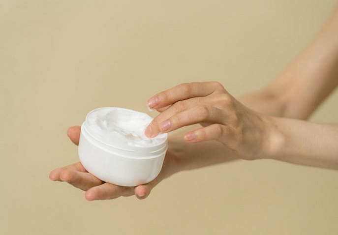Lightweight moisturizer being applied during travel for hydrated skin in all climates