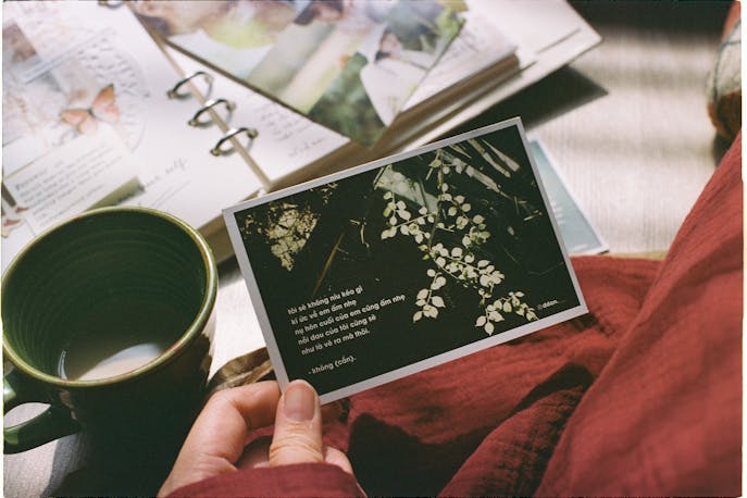 Journal and tea representing healing essentials during travel after a breakup and emotional recovery journey