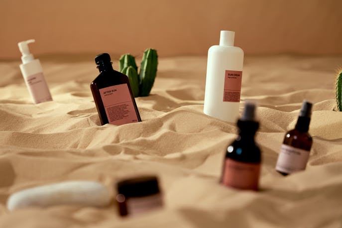 Compact skincare containers and droppers with minimal design