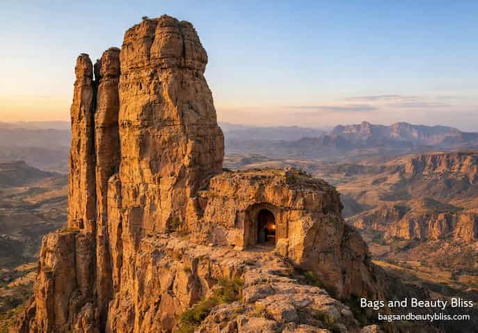 Abuna Yemata Guh rock-hewn church carved into sandstone cliffs in Tigray, Ethiopia, overlooking rugged mountain valleys