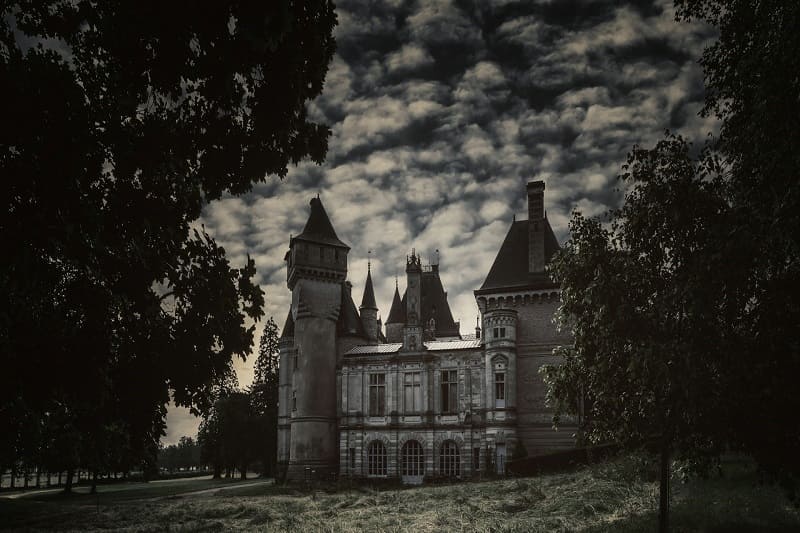 Spooky castle under dark sky with eerie atmosphere